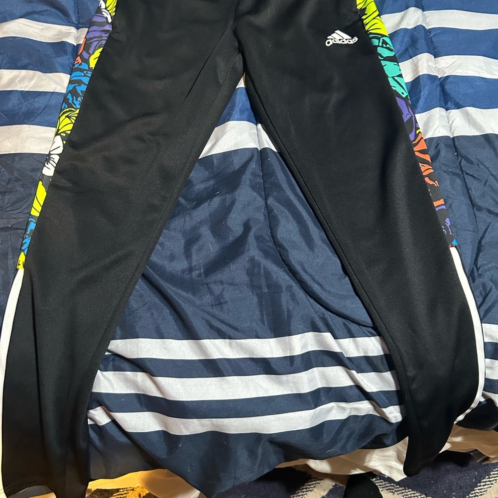 Size small men’s Adidas track pants, black with the floral print on the sides